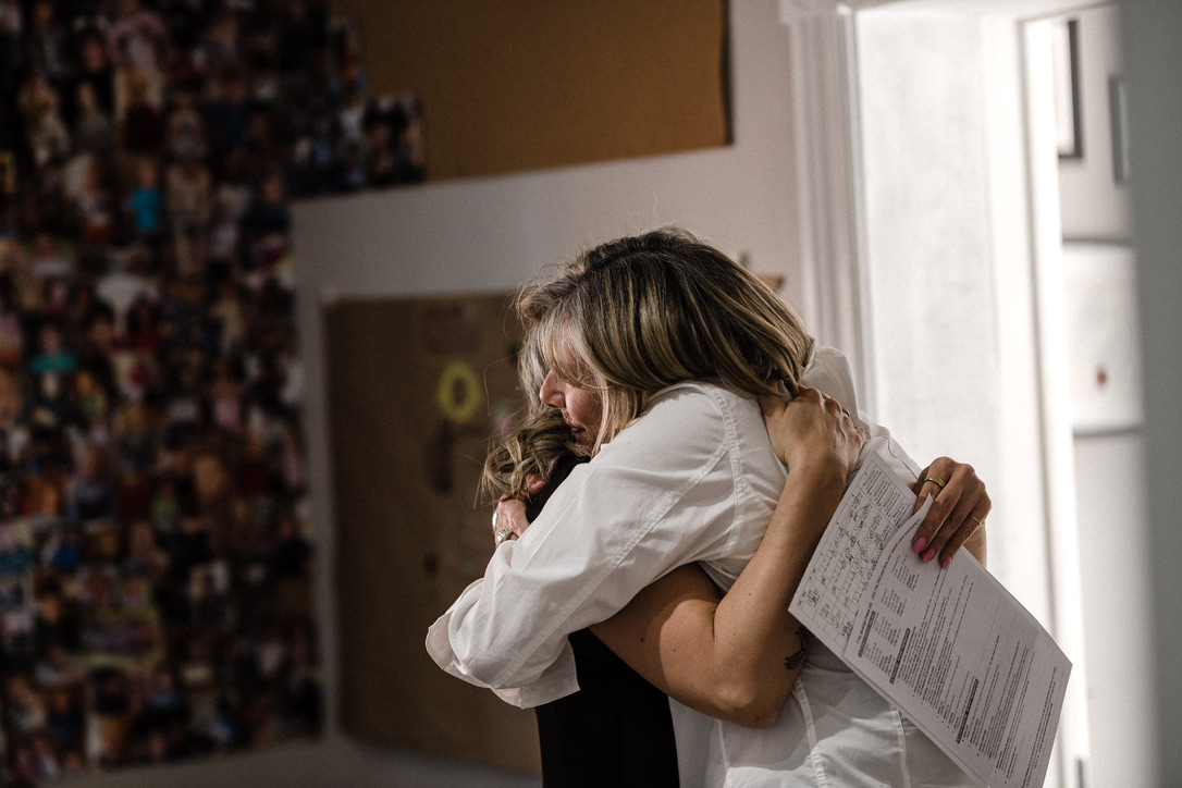 busy mom hugging her child at home showing connection and support